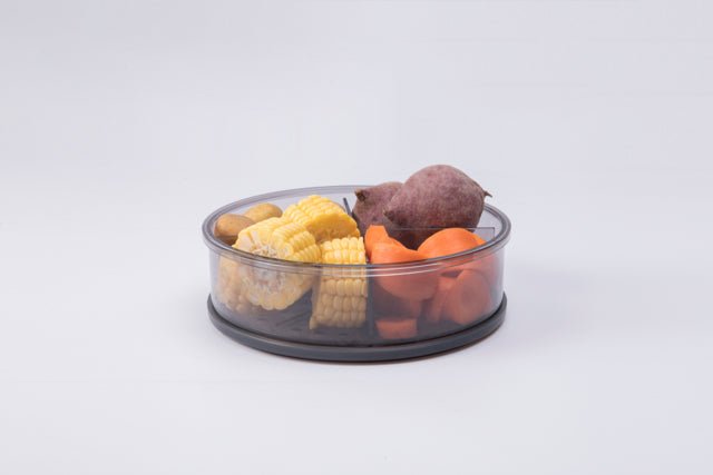 Dämpfaufsatz aus Polycarbonat mit transparentem Design und individuell verstellbaren Trennwänden, ideal zum gleichzeitigen Dämpfen verschiedener Speisen.