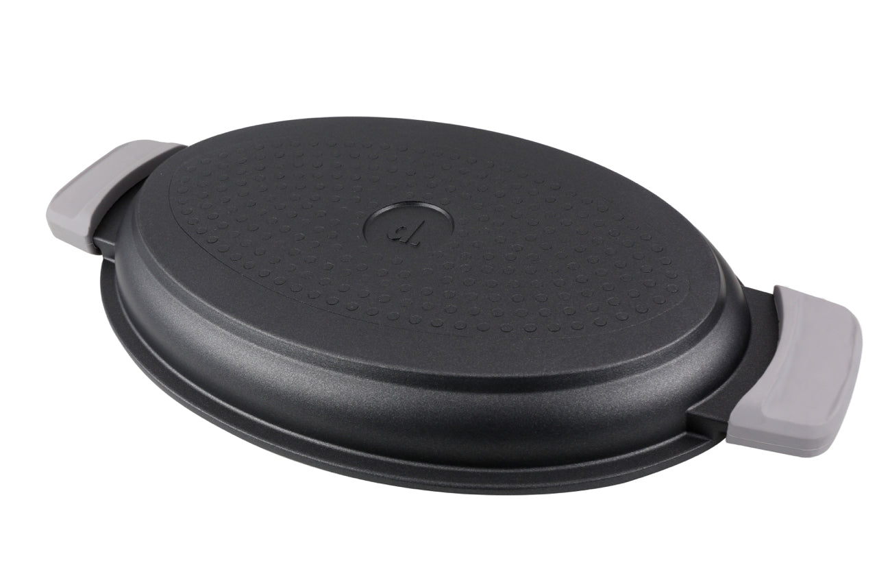 Ovale Multi-Bräter Edition 5 aus Aluguss mit hitzebeständigen Griffen und Premium-Antihaftbeschichtung.